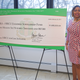 AKA-EAF Executive Director Erika Everett poses with the foundation’s inaugural endowment check.